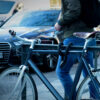 Textile rope lock tex-lock orbit in black secures bike frame to bike stand on a street
