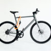 Flexible textile lock tex-lock orbit in orange on urwahn bike frame and tire